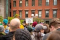 Protester marching for a peace pride rainbow flag at the Boston March for Our Lives political rally