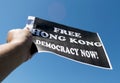 Protester are seen holding up banners with the message Free Hong Kong. Democracy Now