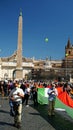 Protesters hold up a huge tricolor marching from Piazza del Popolo to Piazza Venezia