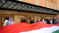 protesters hold up a huge tricolor marching from Piazza del Popolo to Piazza Venezia