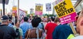 Protesters holding placards & posters at the March Against Racism demonstration of the dramatic rise of acid race related attacks