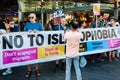 Protesters holding placards & posters at the March Against Racism demonstration of the dramatic rise of acid race related attacks