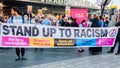 Protesters holding placards & posters at the March Against Racism demonstration of the dramatic rise of acid race related attacks