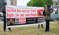 Protesters holding sign at Black Lives Matter protest demonstration in London. Royalty Free Stock Photo