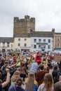 Protesters kneel at a Black Lives Matter rally in Richmond, North Yorkshire, with Richmond Castle in the background Royalty Free Stock Photo