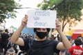 Protesters show text mean `Politics is not a joke.`