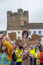 Protesters wearing face masks hold Black Lives Matter placards in front of Richmond Castle, North Yorkshire Royalty Free Stock Photo