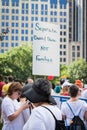 Protestor Holds Sign Calling for Separation of Church and State not Families