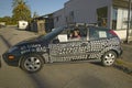 A protestor flashing the peace sign in his car