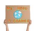 Protestor holding placard with text We Need A Change on white background, closeup. Climate strike