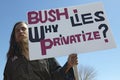 Protestor in Tucson Arizona of President George W. Bush holding a sign protesting his Iraq foreign policy