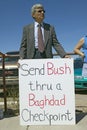 Protestor in Tucson Arizona of President George W. Bush holding a sign protesting his Iraq foreign policy