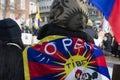 Protestor wearing Tibet flag