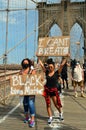 Protestors hold up signs Royalty Free Stock Photo