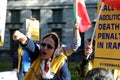 Protestors linked to the Iranian group Mojahedin-e Khalq demonstrate in Whitehall, near the