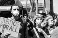 Protestors March and Hold Up Signs Calling for Justice For All at Protest for George Floyd Royalty Free Stock Photo