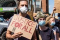 Protestors March and Hold Up Signs Calling for Justice For All at Protest for George Floyd Royalty Free Stock Photo