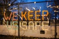 Protests sign we keep us safe on a security fence surrounding White house building after Capitol Hill riots