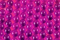 Proton purple spherical ball capsules selective focus weird abstract background