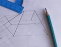 A protractor, pencil, and eraser lie on white paper with a drawn drawing.