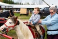 Proud Boy on his First Pony Ride Royalty Free Stock Photo