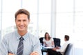 Proud businessman in front of his teamwork Royalty Free Stock Photo