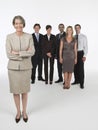 Proud Businesswoman With team Behind Royalty Free Stock Photo