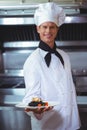 Proud chef holding a plate of squid ink spaghetti Royalty Free Stock Photo