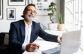 Proud confident glad mature european man professional in suit and glasses work on laptop in modern office interior Royalty Free Stock Photo