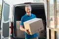 Delivery man holding parcel Royalty Free Stock Photo