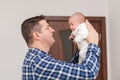 Proud father holding his newborn baby in hands Royalty Free Stock Photo