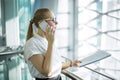 Proud female CEO having smartphone conversation Royalty Free Stock Photo