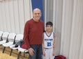 Proud grandfather with grandson after baskeball game