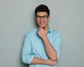 proud happy man with glasses folding arms, touching chin and thinking Royalty Free Stock Photo