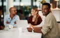 Proud, happy and smiling young businessman holding digital tablet during business meeting. Ambitious young Royalty Free Stock Photo