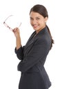 Proud of her accomplishments. Portrait of an attractive young businesswoman holding her glasses isolated on white. Royalty Free Stock Photo