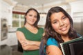 Proud Hispanic Mother and Daughter In Kitchen at Home Ready for Royalty Free Stock Photo
