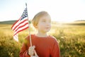 Proud little american boy holding his country flag Royalty Free Stock Photo