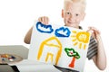 Proud little boy holding up a colorful painting Royalty Free Stock Photo