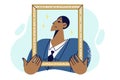 Proud man in business clothes holding golden portrait frame, for concept of narcissism