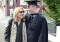 Proud mother and University Graduate son smiling & hugging