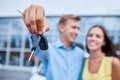 The family bought a new car in the showroom. The concept of buying a new car. Royalty Free Stock Photo