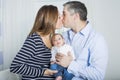 Proud Parents Holding Baby in the bedroom Royalty Free Stock Photo