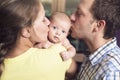 Proud Parents Holding Baby in the bedroom Royalty Free Stock Photo