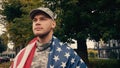 proud soldier with american flag standing