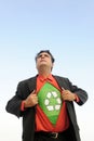 Proud to recycle: businessman is a recycling hero Royalty Free Stock Photo