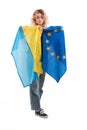 Proud and upset caucasian blonde-haired woman in her 20s holding Ukrainian and European flags together. Europe for