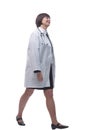 proud woman doctor striding forward. isolated on a white background. Royalty Free Stock Photo