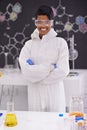 A proud woman of science. A portrait of a beautiful young scientist standing proudly in her laboratory. Royalty Free Stock Photo