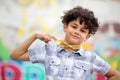 Proud young boy pointing to his bow tie Royalty Free Stock Photo
